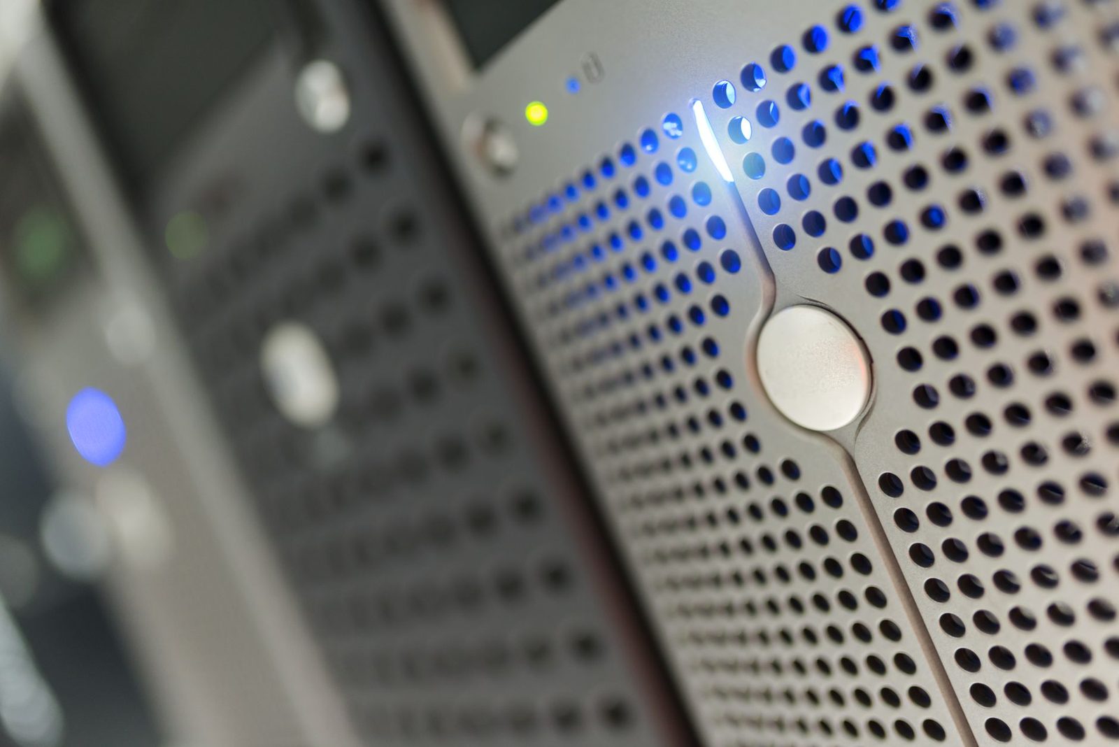 rows of servers in a modern data center with cool blue...