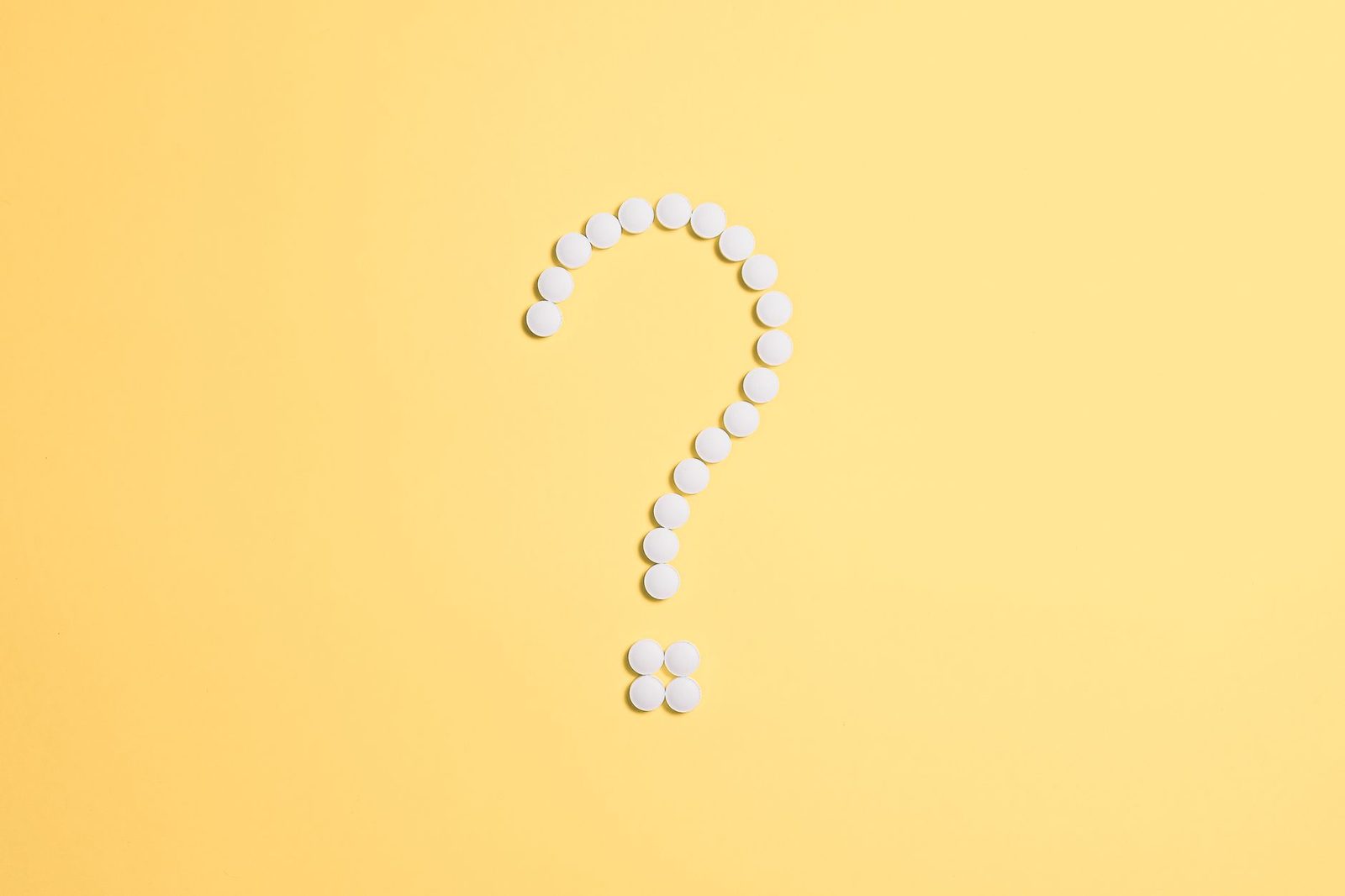 single question mark on white paper doubt uncertainty...