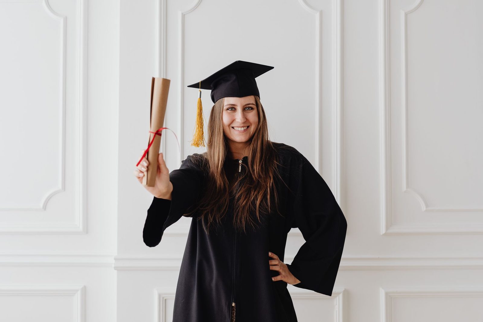 graduation gown diploma certificate framed on wall...